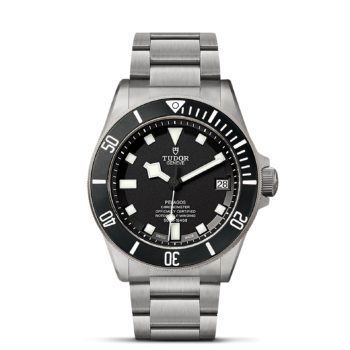 A M25600TN-0001 black dial watch on a black background.
