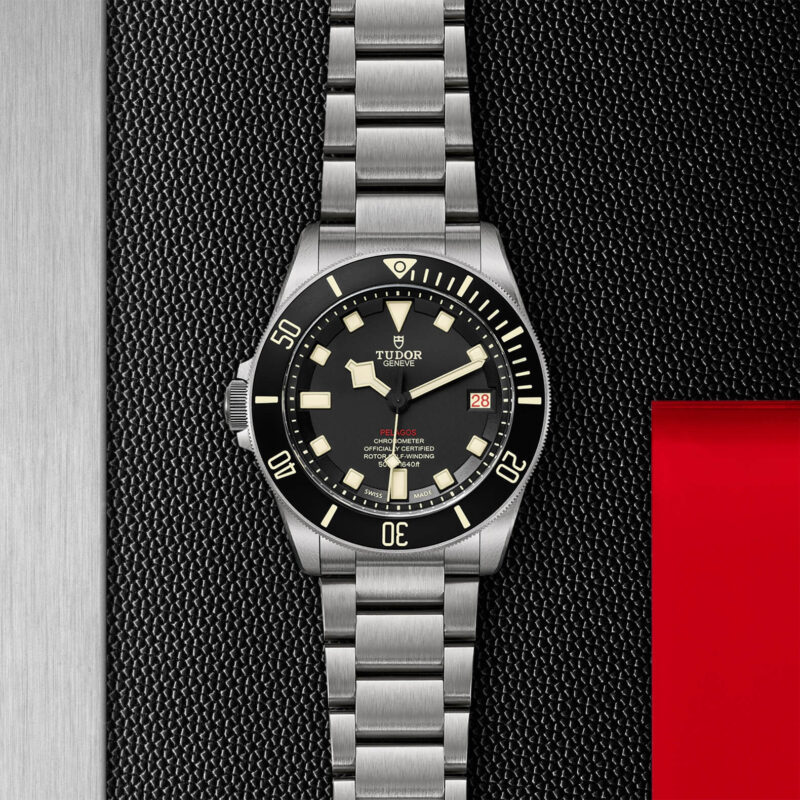 A M25610TNL-0001 watch on a red and black background.
