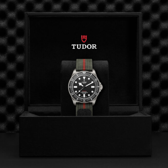 A M25717N-0001 in a box with the words tudor on it.