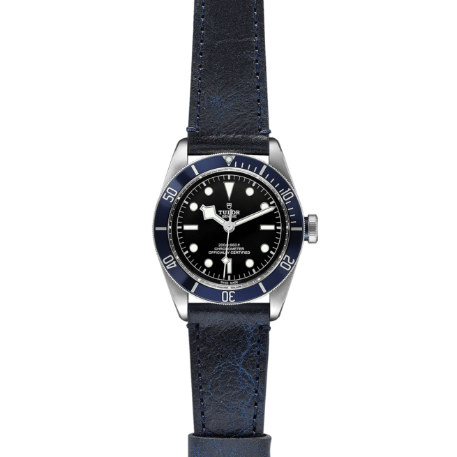 A M79230B-0007 watch with a blue leather strap.