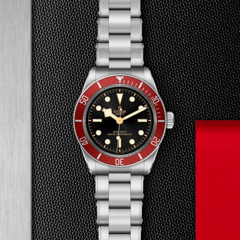 A tudor M7941A1A0RU-0001 watch with a red bezel.