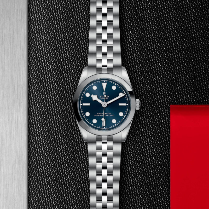 A M79600-0002 watch with a blue dial.