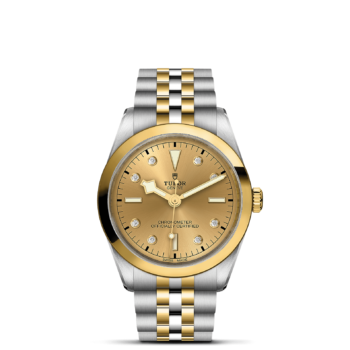 A M79643-0008 watch with two tone gold and diamonds.