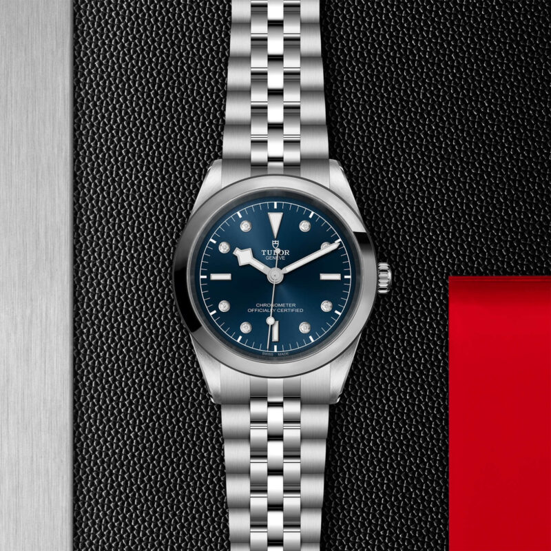 A tudor M79680-0005 with a blue dial on a black leather strap.