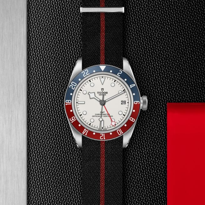 A M79830RB-0012 with red and white stripes on a black background.