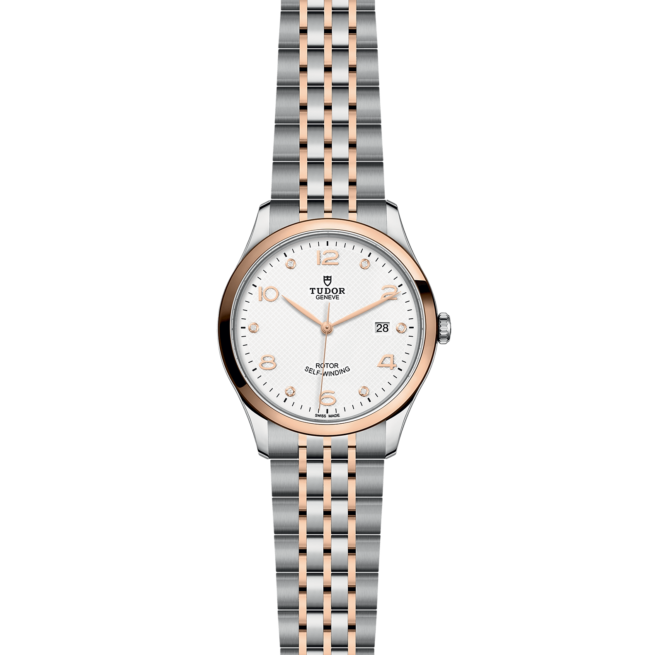 A women's watch with a silver and rose gold bracelet.