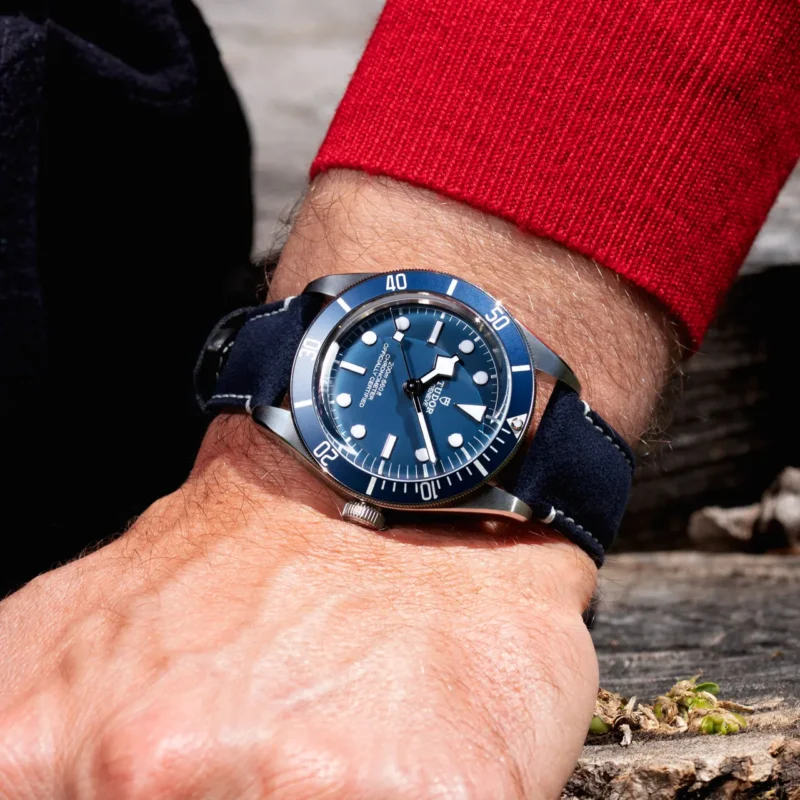 A man is wearing a M79030B-0002 on his wrist.