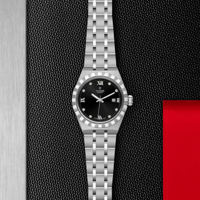 A M28300-0004 watch on a red background.