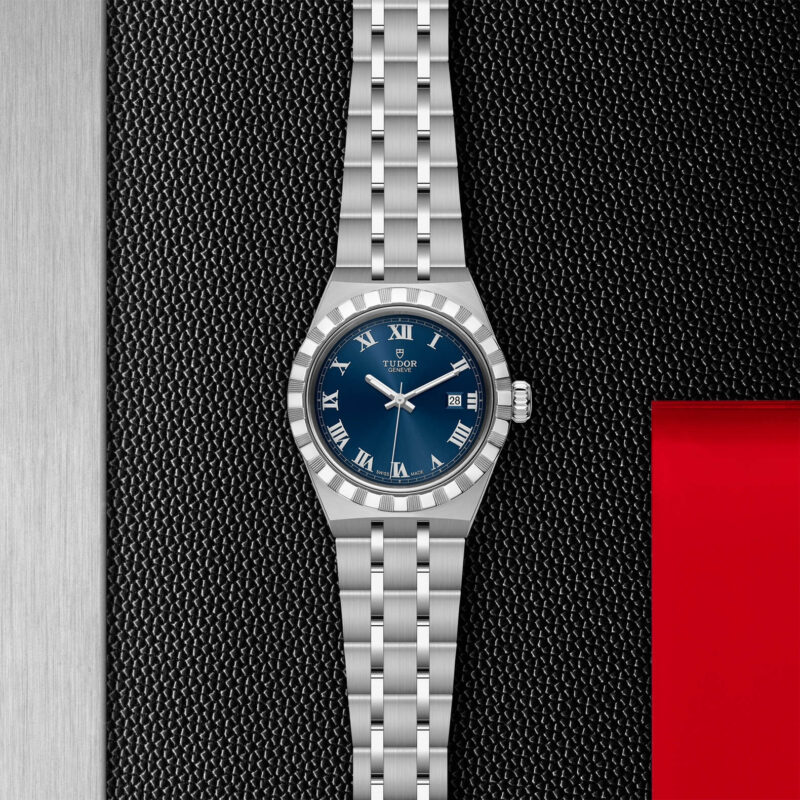 A M28300-0006 with a blue dial on a black background.