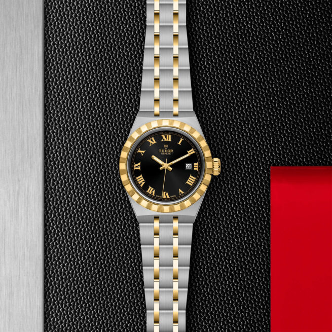 A M28303-0003 watch on a red background.