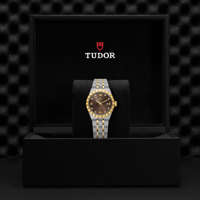 A tudor watch in a black M28303-0009 box.