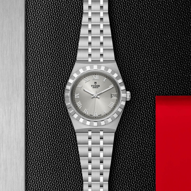 A M28400-0001 watch on a black and red background.