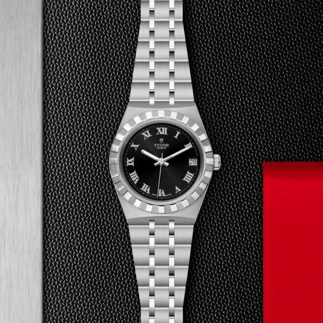 A M28400-0003 watch on a red background.
