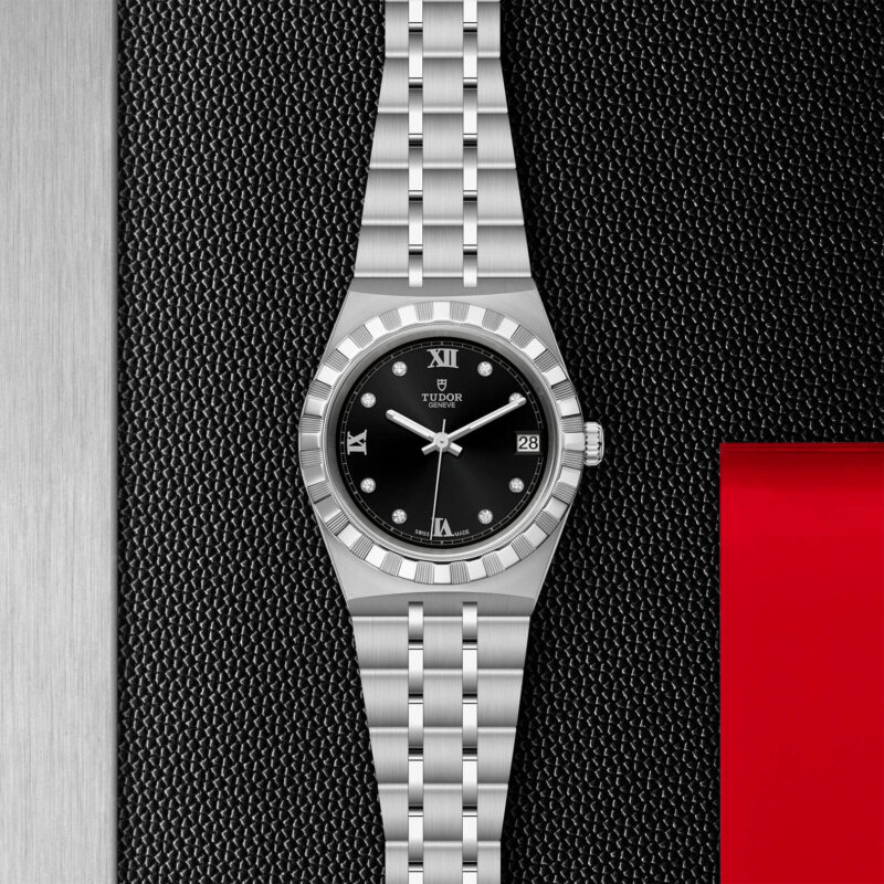 A M28400-0004 watch on a red background.