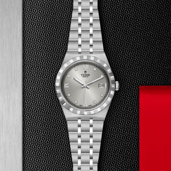 A M28500-0002 watch on a black and red background.