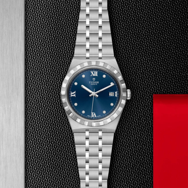 A M28500-0006 with a blue dial on a black background.