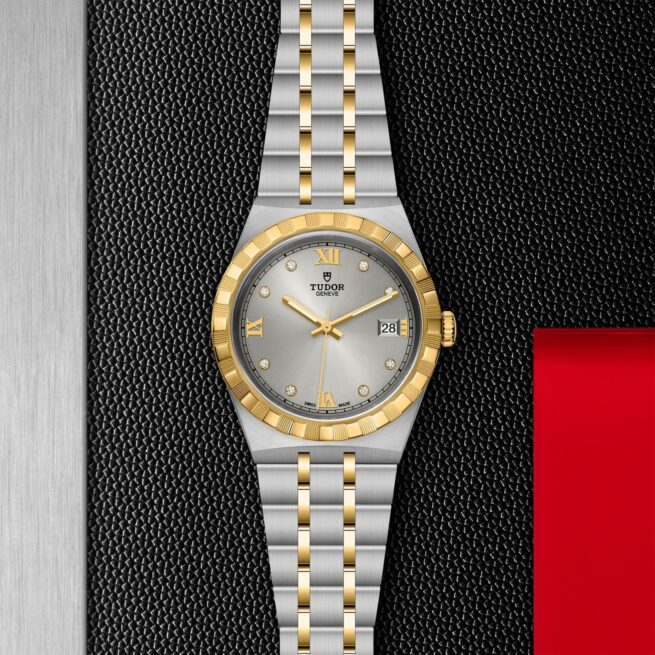 A women's watch with gold and silver accents on a black background. M28503-0002