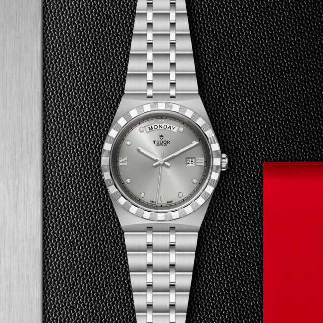 A M28600-0002 watch on a red background.