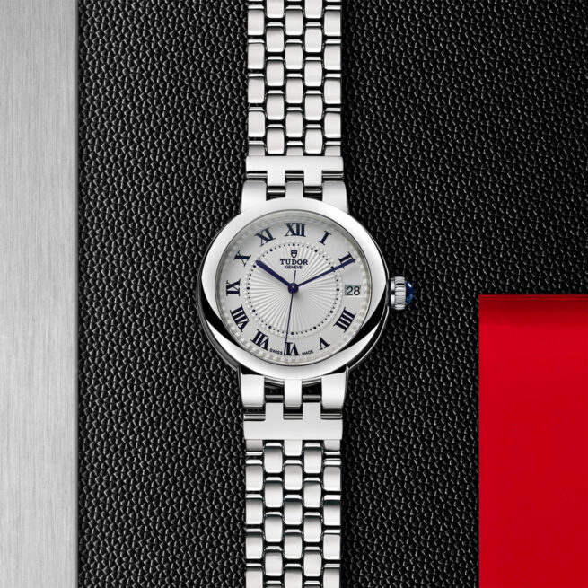 A women's watch with roman numerals on a black background, like the M35800-0001.