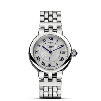 A M35800-0001 watch with roman numerals on a black background.