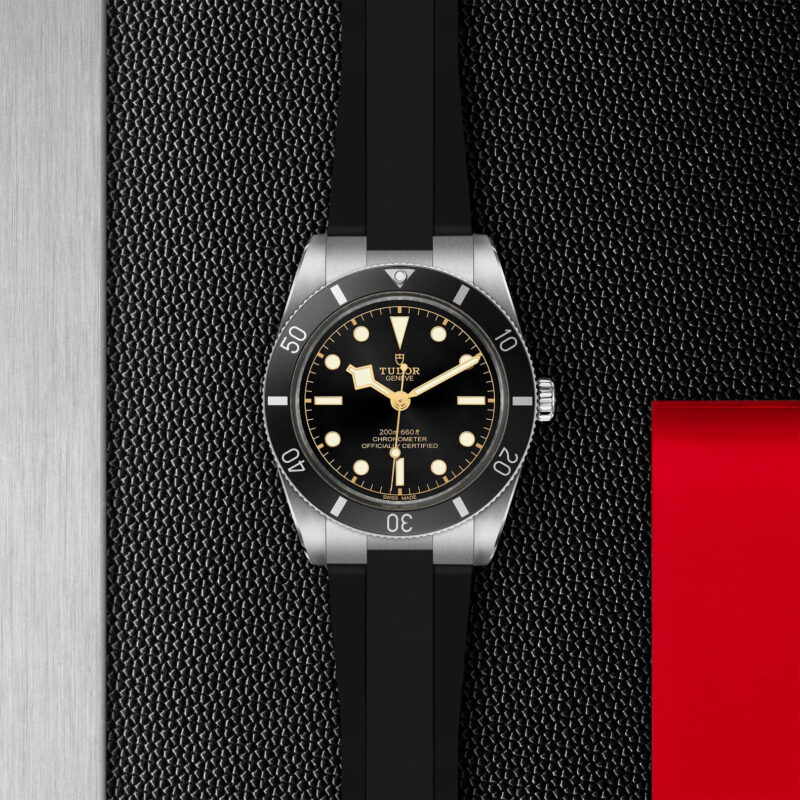 A M79000N-0002 watch on a black leather strap.