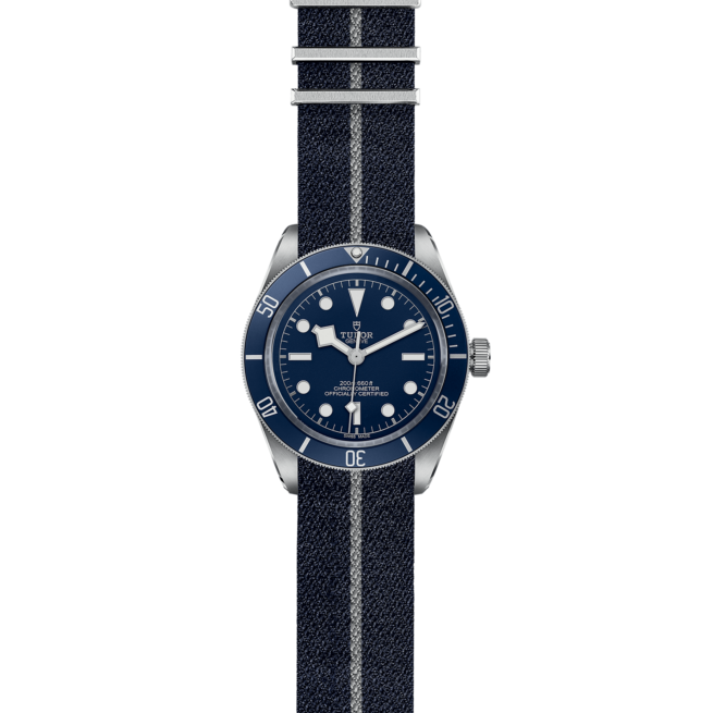 The M79030B-0003 watch on a blue canvas strap.