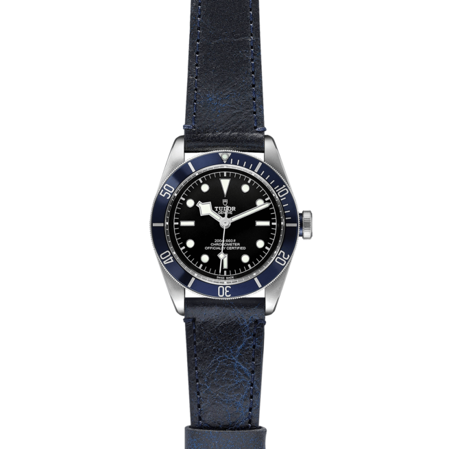 A M79230B-0006 watch with a blue leather strap.