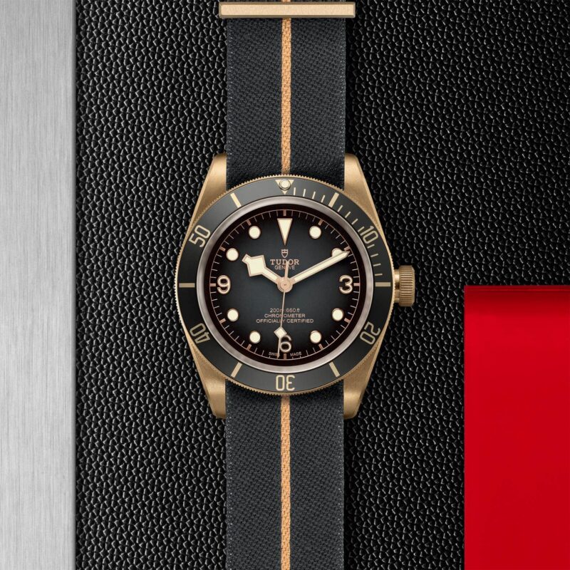 A M79250BA-0002 watch on a black leather strap.