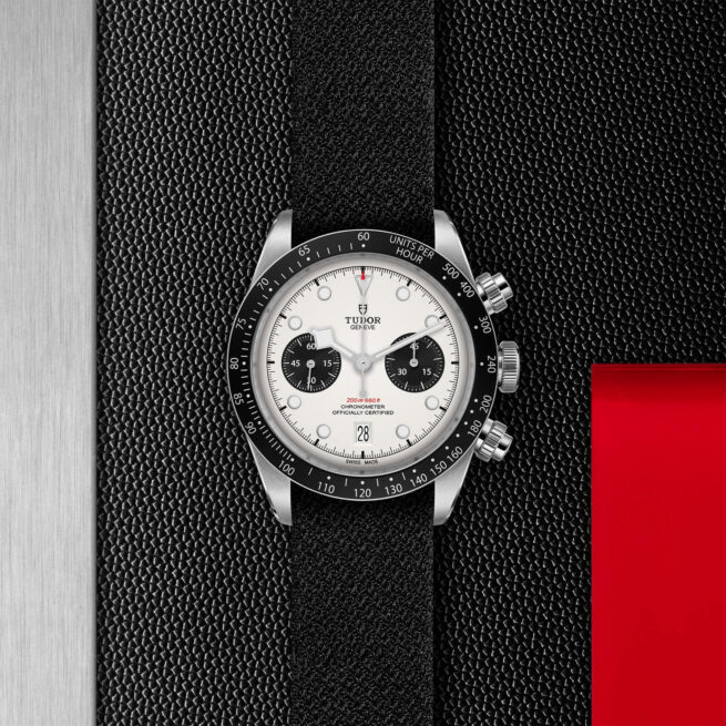 The M79360N-0008 is a black and white watch with a red strap.