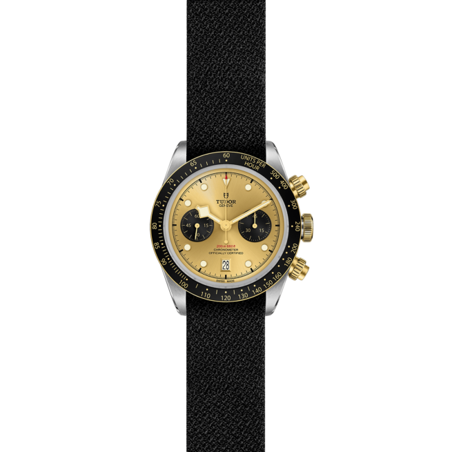 A M79363N-0006 watch with a gold dial and black strap.