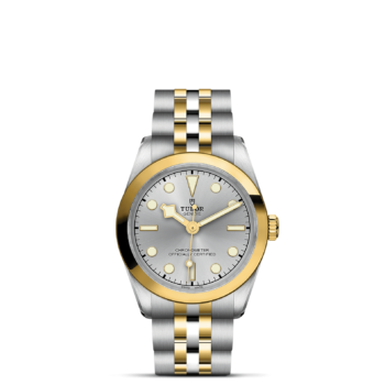 A M79603-0002 watch with a gold and silver dial.