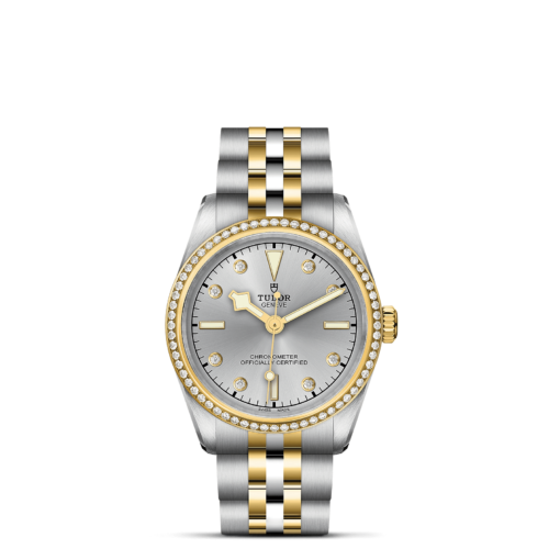 A M79613-0006 watch with two tone gold and diamonds.