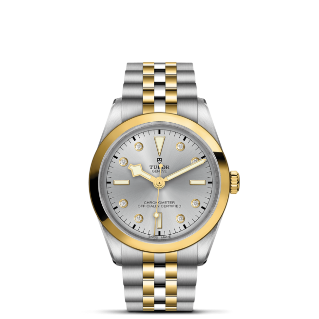 A M79643-0007 watch with a silver and gold dial.