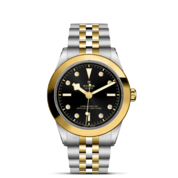 A tudor black bay watch (M79663-0006) with two tone gold and black dial.