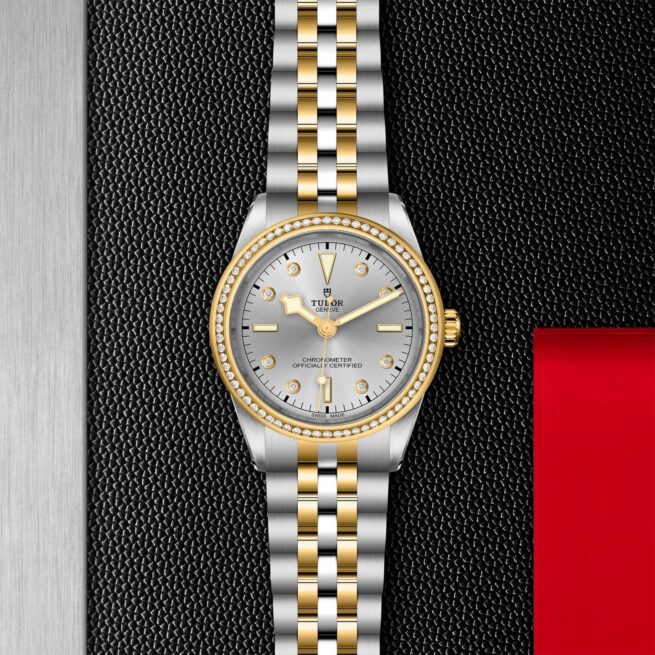 A M79673-0005 ladies watch with a gold and silver dial.