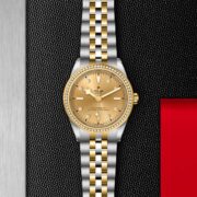 A M79673-0007 ladies watch on a red leather strap.