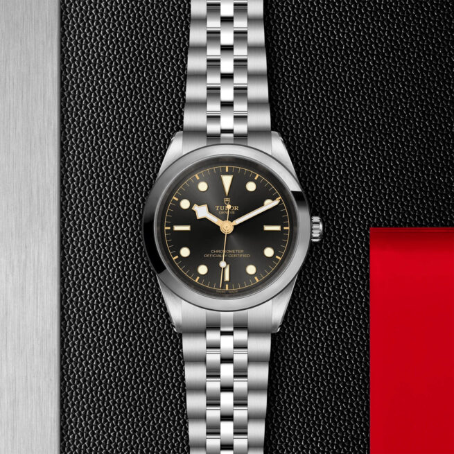 A M79680-0001 on a black leather strap.