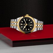 A M79683-0001 watch on a red table.