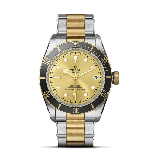 A M79733N-0004 yellow dial watch on a black background.