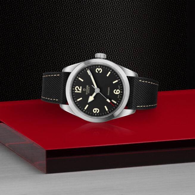 A M79950-0002 watch on a red table.