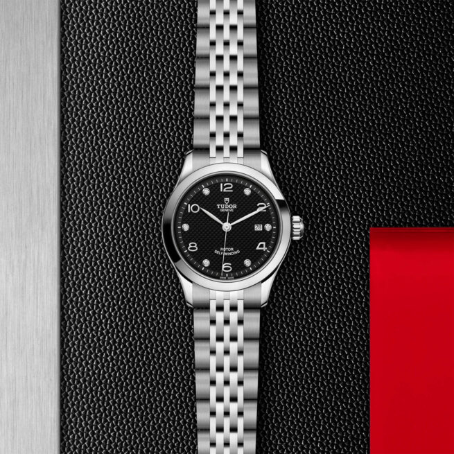 A M91350-0004 watch on a red background.