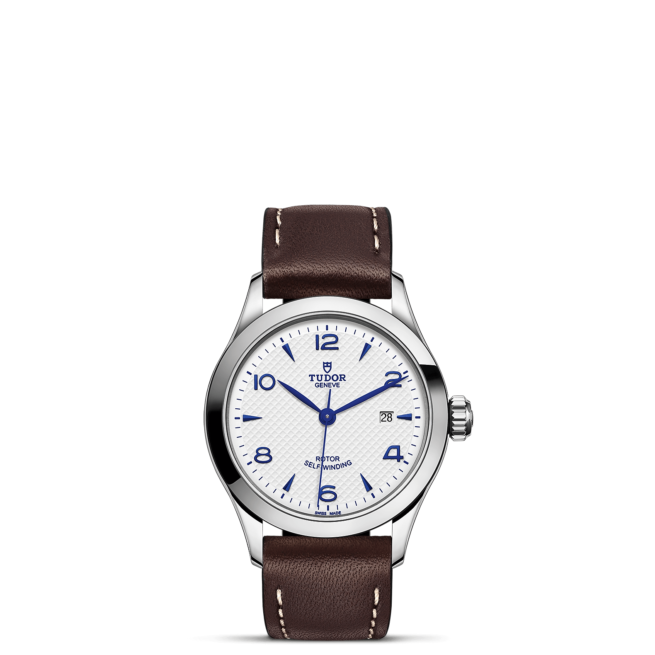 A M91350-0010 with a white dial and brown leather strap.