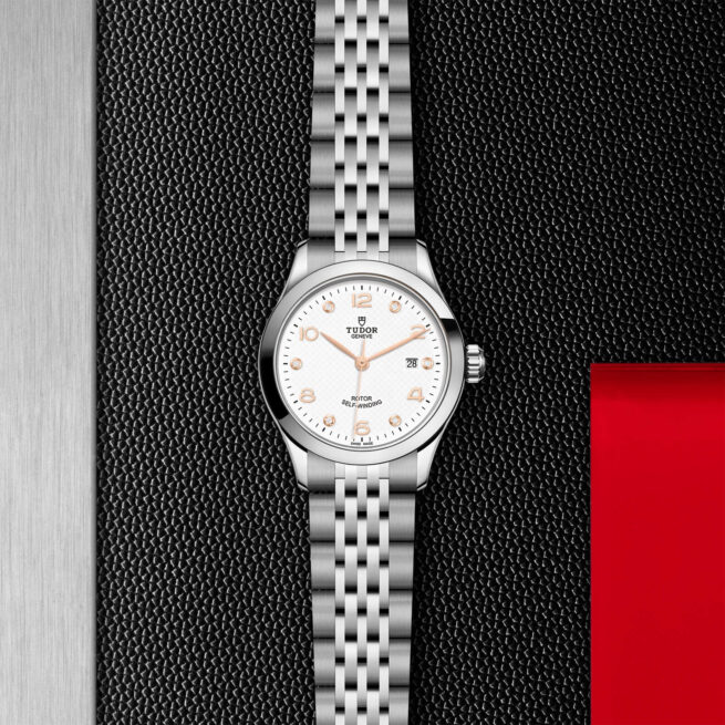 M91350-0013 lady's watch on a black leather background.