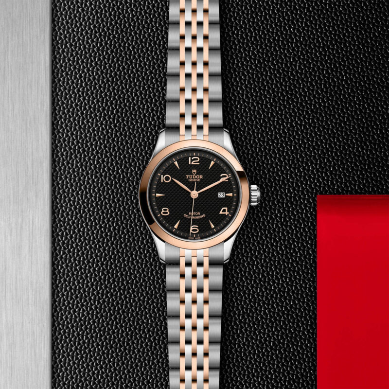 A M91351-0003 watch on a red background.