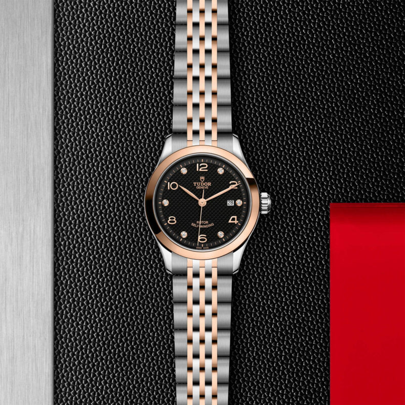 A lady's watch with a M91351-0004 dial on a black background.