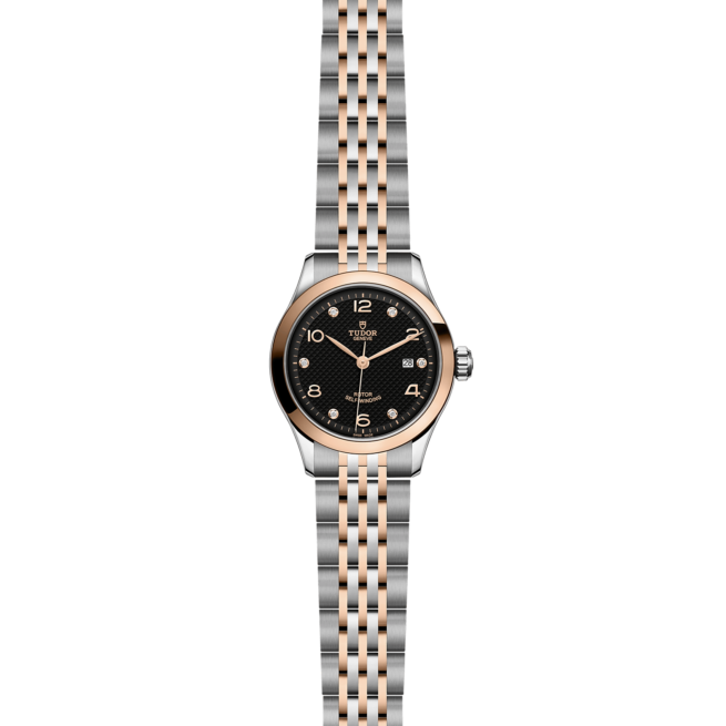 A M91351-0004 ladies watch with a black dial and rose gold bracelet.