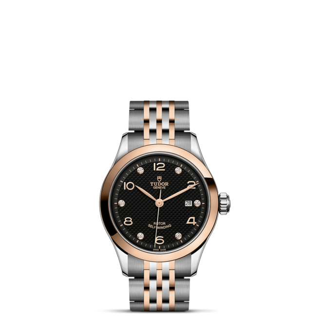 A watch with a black dial and rose gold bezel, the M91351-0004.