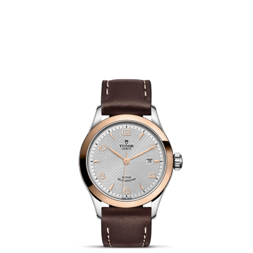 A M91351-0005 with brown leather straps on a black background.