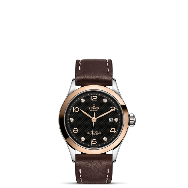 A M91351-0008 with brown leather strap and black dial.