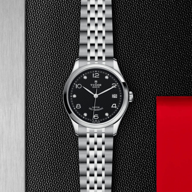A M91450-0004 watch on a red background.